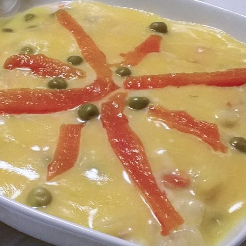 A layer of mayonnaise with a few decorations on top