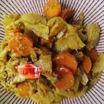 On a bed of fennel and braised carrots, pieces of sesame chicken