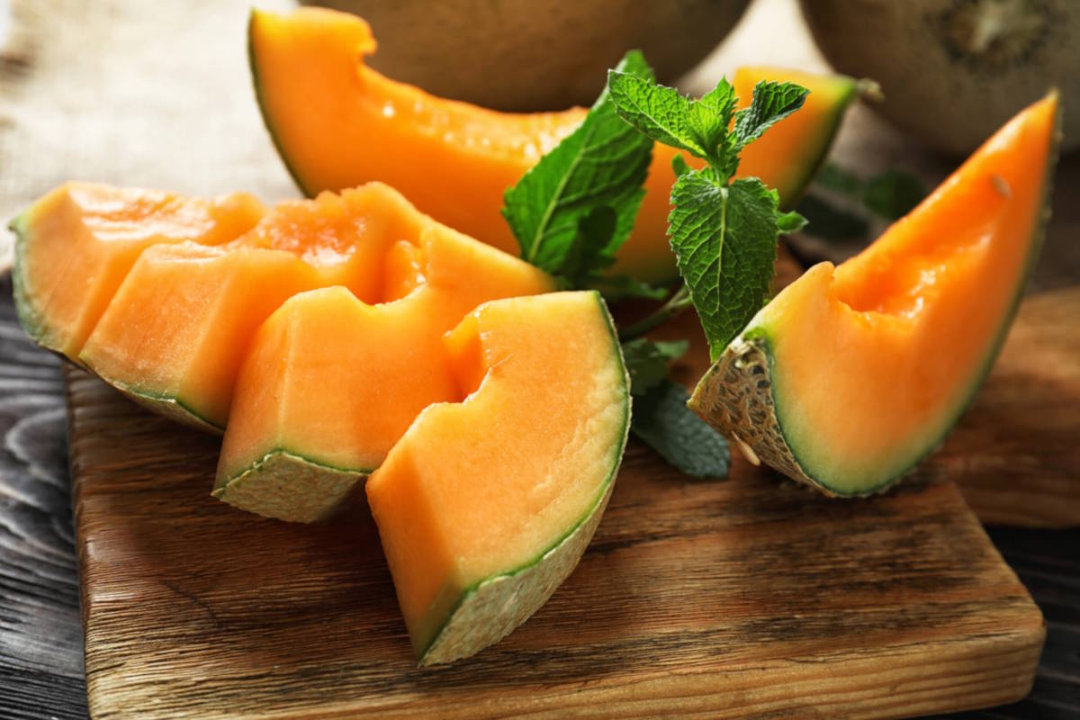 Melon wedges and mint leaves