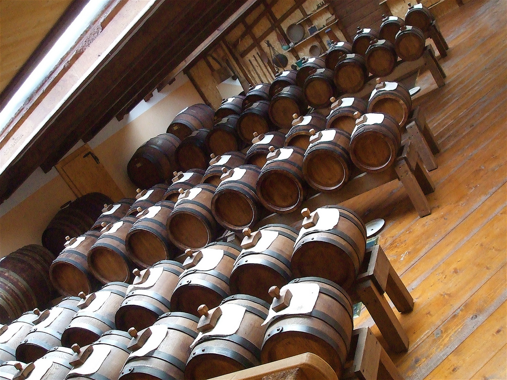View of a Modena vinegar factory with rows of vinegar barrels